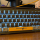 A photo of the Retro PC Shurikey Hanzo keyboard with a dark gray frame swapped out for the original light gray.